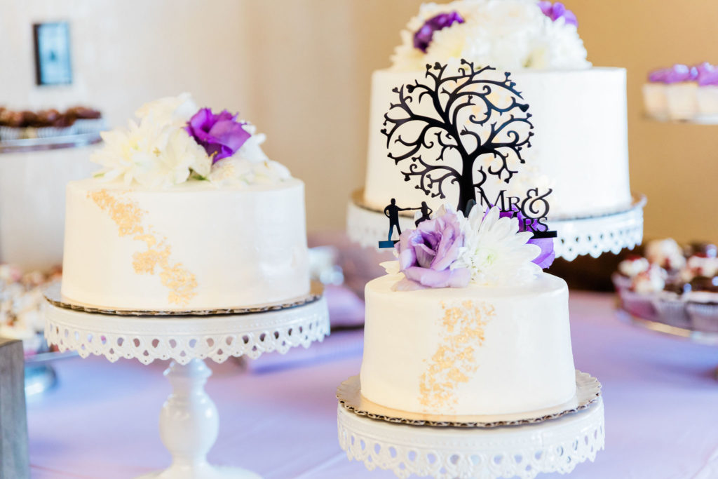 Three tier wedding cake with purple accents