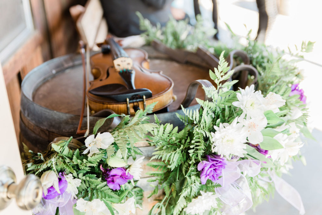 Carmel violin with purple wedding florals