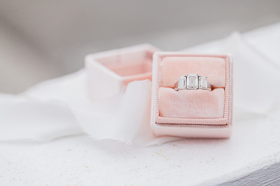 triple diamond emerald cut engagement ring