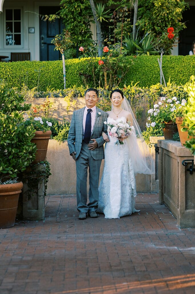 La Playa Hotel Wedding walking down the aisle