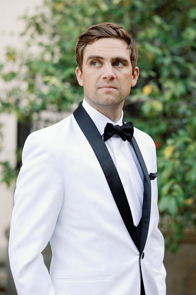 Stonepine Estate Groom in white tuxedo